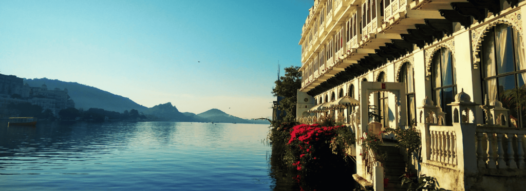 A stunning lake view showcasing a beautiful building in the distance, harmoniously blending with the natural landscape.