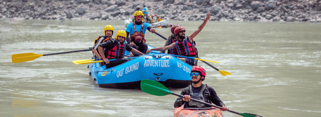 A diverse group of individuals enjoying a leisurely boat ride on a serene river surrounded by lush greenery.