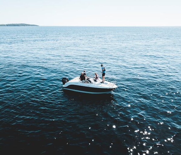 a group of people on a boat in the water