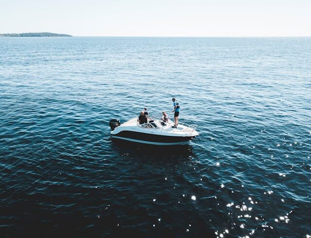 a group of people on a boat in the water