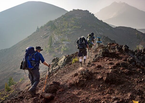a group of people hiking on a rocky mountain